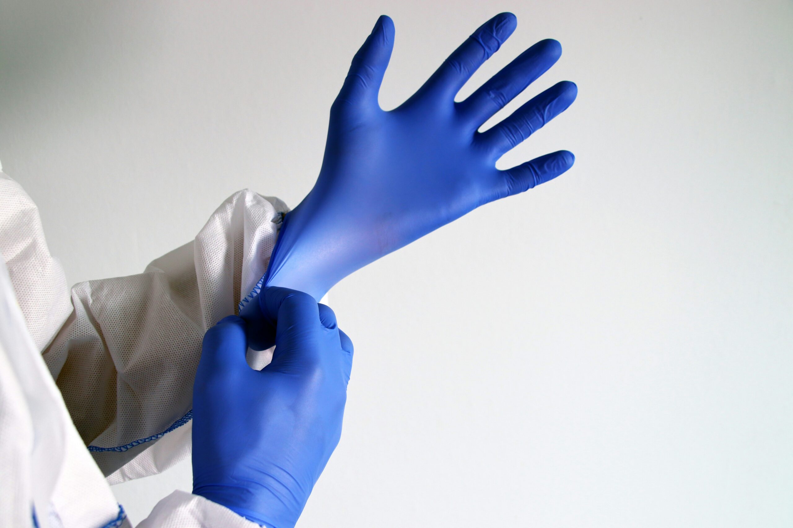 Blue nitrile protective glove shown palm up