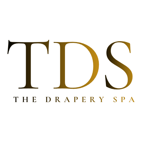 The Drapery Spa transparent gold logo, specialist drapery cleaning Dallas Texas